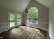 Light-filled dining room features wood floors and a large window offering outdoor views at 2032 Sherry Lynn Dr, Garner, NC 27529