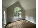 Bright dining room features wood floors and a large window offering outdoor views at 2032 Sherry Lynn Dr, Garner, NC 27529