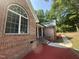 Side view of a brick house with landscaped yard and a charming entryway at 2032 Sherry Lynn Dr, Garner, NC 27529