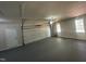 Spacious garage featuring epoxy flooring, providing ample parking and storage at 2032 Sherry Lynn Dr, Garner, NC 27529