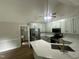 Modern kitchen boasts stainless steel appliances, quartz countertops, and ample cabinet space at 2032 Sherry Lynn Dr, Garner, NC 27529