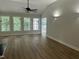Spacious living room with beautiful floors and natural light from large windows at 2032 Sherry Lynn Dr, Garner, NC 27529