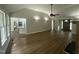 Open-concept living room flowing into the kitchen and dining area with modern finishes and hardwood floors at 2032 Sherry Lynn Dr, Garner, NC 27529