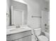 A clean, well-lit bathroom with a white vanity, toilet, and bathtub/shower combo at 209 Broomgrove Way, Wake Forest, NC 27587