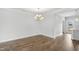Elegant dining room with hardwood floors and a modern chandelier, perfect for gatherings at 209 Broomgrove Way, Wake Forest, NC 27587