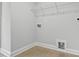 A well-lit laundry room features tile flooring, connections for appliances, and neutral paint at 209 Broomgrove Way, Wake Forest, NC 27587