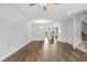 Open concept living room with the view to the kitchen and staircase at 209 Broomgrove Way, Wake Forest, NC 27587