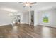 View of open concept living room into the kitchen and staircase with hardwood floors at 209 Broomgrove Way, Wake Forest, NC 27587
