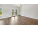 Neutral living room with hardwood floors, doors to the backyard and bright light at 209 Broomgrove Way, Wake Forest, NC 27587