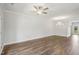 Living room with hardwood floors, neutral paint and bright light with doors to the outside at 209 Broomgrove Way, Wake Forest, NC 27587