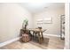 Bright office space boasts a modern desk, wood floors, and calming artwork at 209 Broomgrove Way, Wake Forest, NC 27587