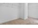 Bright walk-in closet with neutral carpet and wire shelving for optimal storage solutions at 209 Broomgrove Way, Wake Forest, NC 27587