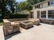 Backyard patio featuring custom stone seating, access to home, and view of exterior siding at 223 Shadowbrook Dr, Burlington, NC 27215