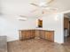 Finished basement featuring tile floors, brick walls, and wood cabinets, provides a versatile living space at 223 Shadowbrook Dr, Burlington, NC 27215