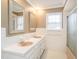 Bathroom with double vanity and glass enclosed tub shower at 223 Shadowbrook Dr, Burlington, NC 27215