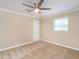 Cozy bedroom with a ceiling fan and a large window at 223 Shadowbrook Dr, Burlington, NC 27215