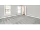 Bright bedroom with new carpet, two windows, and closet for plenty of space at 223 Shadowbrook Dr, Burlington, NC 27215