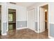 Hallway with tile floors, leading to bedrooms, closets, and other living areas at 223 Shadowbrook Dr, Burlington, NC 27215