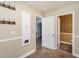 Hallway with tile floors, coat hooks, doors to rooms, and classic architectural elements, blends comfort and style at 223 Shadowbrook Dr, Burlington, NC 27215
