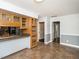 Bright kitchen with wood cabinets, tiled floor and open view to living spaces at 223 Shadowbrook Dr, Burlington, NC 27215