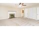 Spacious main bedroom features a cozy fireplace and access to the en-suite bathroom at 223 Shadowbrook Dr, Burlington, NC 27215