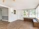 Sun room with tile floors, lots of windows, and built in seating, offering an inviting atmosphere at 223 Shadowbrook Dr, Burlington, NC 27215