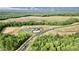 An aerial view shows a planned community with a pool, tennis courts, and newly constructed homes at 2313 Abbeyhill Dr # 3, Raleigh, NC 27610