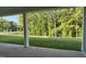 Spacious backyard view from the covered porch of a new home, overlooking lush green landscape at 2313 Abbeyhill Dr # 3, Raleigh, NC 27610