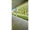 Covered porch showcasing view of large grassy backyard surrounded by mature trees at 2313 Abbeyhill Dr # 3, Raleigh, NC 27610