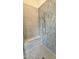 Beautiful walk-in shower with gray honeycomb tile surround, a built-in bench, and rain shower head at 2313 Abbeyhill Dr # 3, Raleigh, NC 27610