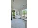 Bright bathroom featuring a white vanity with drawers and a large window overlooking lush trees at 2313 Abbeyhill Dr # 3, Raleigh, NC 27610