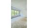 Spacious bedroom with lots of natural light, neutral carpet, and tree views at 2313 Abbeyhill Dr # 3, Raleigh, NC 27610