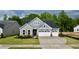 Charming craftsman-style home with a well-manicured lawn and attached three car garage at 2313 Abbeyhill Dr # 3, Raleigh, NC 27610