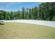 This serene backyard features a privacy fence surrounded by mature trees at 2501 Impulsion Dr, New Hill, NC 27562