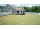 The expansive backyard features green grass and a new white fence at 2501 Impulsion Dr, New Hill, NC 27562