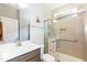 Bathroom featuring a vanity, toilet and a tiled glass enclosed shower with a bench at 2501 Impulsion Dr, New Hill, NC 27562