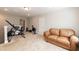 Bonus room with exercise equipment and a leather sofa, perfect for a home gym or recreation space at 2501 Impulsion Dr, New Hill, NC 27562