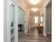 Entryway with hardwood floors, decorative mirror and easy access to a home office space at 2501 Impulsion Dr, New Hill, NC 27562