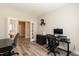 Well-lit office features french doors, wood floors, and built-in features perfect for any professional at 2501 Impulsion Dr, New Hill, NC 27562