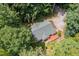 Aerial view of a home with a large roof, a deck, and a lush backyard at 2805 Evans St, Durham, NC 27705