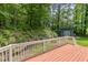 Wooded backyard with a wooden deck overlooking a storage shed at 2805 Evans St, Durham, NC 27705