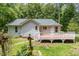 Charming backyard with a deck, small garden, and lush greenery at 2805 Evans St, Durham, NC 27705