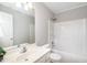 Cozy bathroom featuring a shower-tub combo and vanity sink with a neutral color palette at 2805 Evans St, Durham, NC 27705