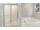 Bright bathroom featuring walk-in shower and bathtub at 2805 Evans St, Durham, NC 27705