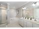 Bright bathroom featuring double vanity sink, walk-in shower and bathtub at 2805 Evans St, Durham, NC 27705