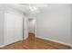 Bright bedroom with hardwood floors, ceiling fan, and ample closet space at 2805 Evans St, Durham, NC 27705