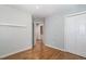 Bedroom featuring hardwood floors, closet and direct access to the bathroom at 2805 Evans St, Durham, NC 27705