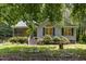Home exterior showcasing well-maintained lawn and shrubbery, and walkway at 2805 Evans St, Durham, NC 27705