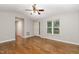 Bright and airy living room with hardwood floors, fan, and natural light at 2805 Evans St, Durham, NC 27705