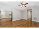Open-concept living area with hardwood floors, fan, and recessed lighting at 2805 Evans St, Durham, NC 27705